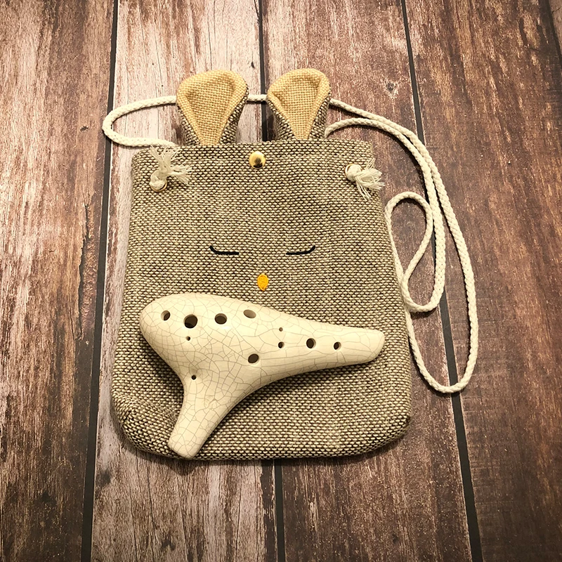 12 Holes Ceramic Ocarina with Cute Bag Flute Alto C Smoked Burn Submarine Style Musical Instrument with Music Score for Beginner
12 Holes Ceramic Ocarina with Cute Bag Flute Alto C Smoked Burn Submarine Style Musical Instrument with Music Score for Beginner