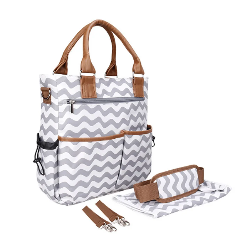 Multifunctional Mummy Maternity Diaper Bags Change Pad Hooks Tissue Box Baby Bag Travel Nappy Bag New Fashion Diaper Tote Bag
Multifunctional Mummy Maternity Diaper Bags Change Pad Hooks Tissue Box Baby Bag Travel Nappy Bag New Fashion Diaper Tote Bag