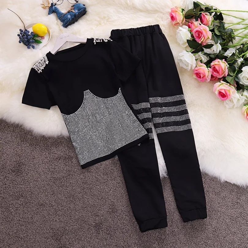 Taotrees Women Summer Chic Round Collar Short Sleeve Diamond T-shirt + High Waist Harlan Pants 2 Piece Sports Set Female
Taotrees Women Summer Chic Round Collar Short Sleeve Diamond T-shirt + High Waist Harlan Pants 2 Piece Sports Set Female