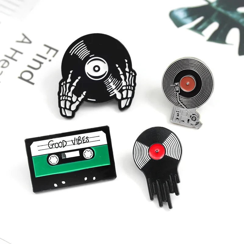 Fashion cartoon Creative drip retro tape vinyl record hand holding record combination brooch For Women
Fashion cartoon Creative drip retro tape vinyl record hand holding record combination brooch For Women
