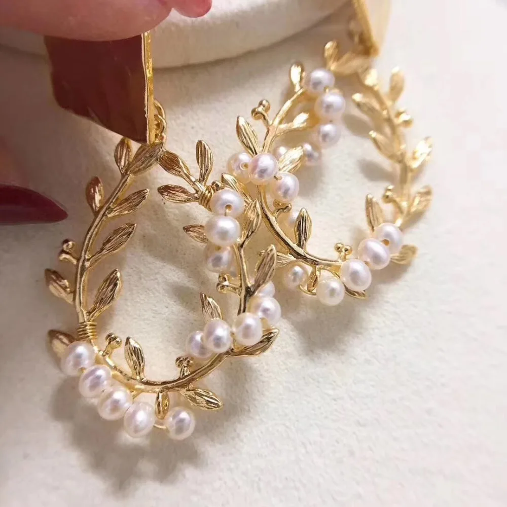 WKOUD Shell Design Pearl Jewelry,925 Sterling Needle 3mm round pearl leaf style drop earrings 14K Gold Injection Original Design
WKOUD Shell Design Pearl Jewelry,925 Sterling Needle 3mm round pearl leaf style drop earrings 14K Gold Injection Original Design