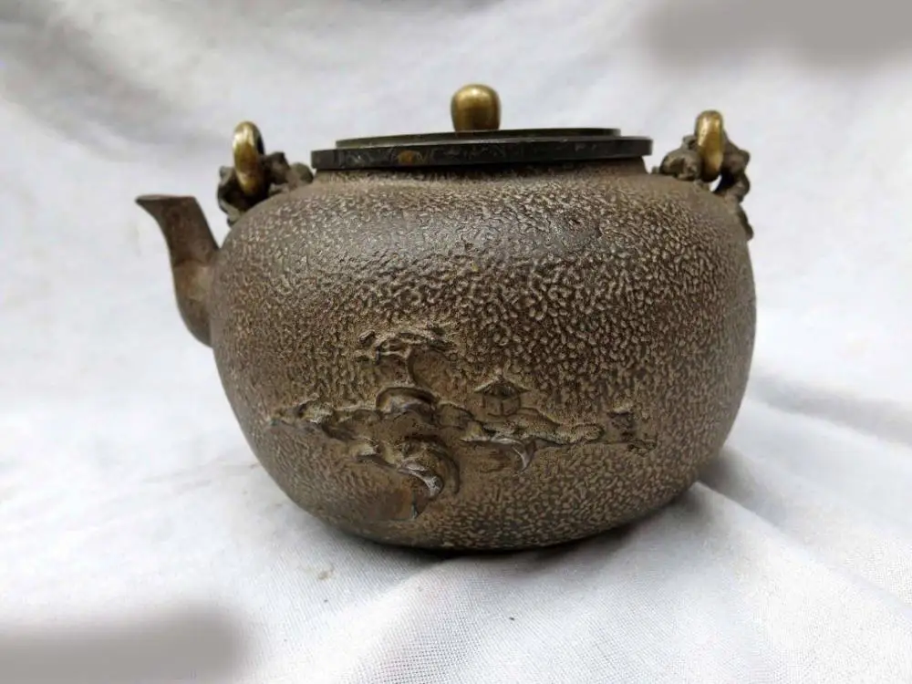 China iron fine workmanship beautiful carven pine tree mountain and kiosk Teapot
China iron fine workmanship beautiful carven pine tree mountain and kiosk Teapot