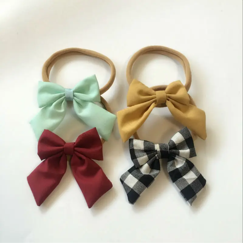 NEW Bow Knot Headbands fabric bow with soft nylon headwear hair accessories 10pcs/lot
NEW Bow Knot Headbands fabric bow with soft nylon headwear hair accessories 10pcs/lot