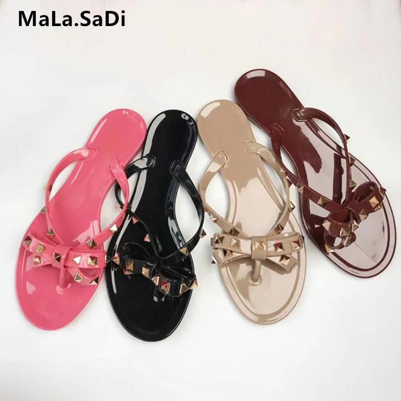 Hot Sale New Fashion Summer Flip Flops Woman Rivets Sandals Bow knot Flat Slippers Girls Studded Cool Beach Slides Jelly Shoes
Hot Sale New Fashion Summer Flip Flops Woman Rivets Sandals Bow knot Flat Slippers Girls Studded Cool Beach Slides Jelly Shoes