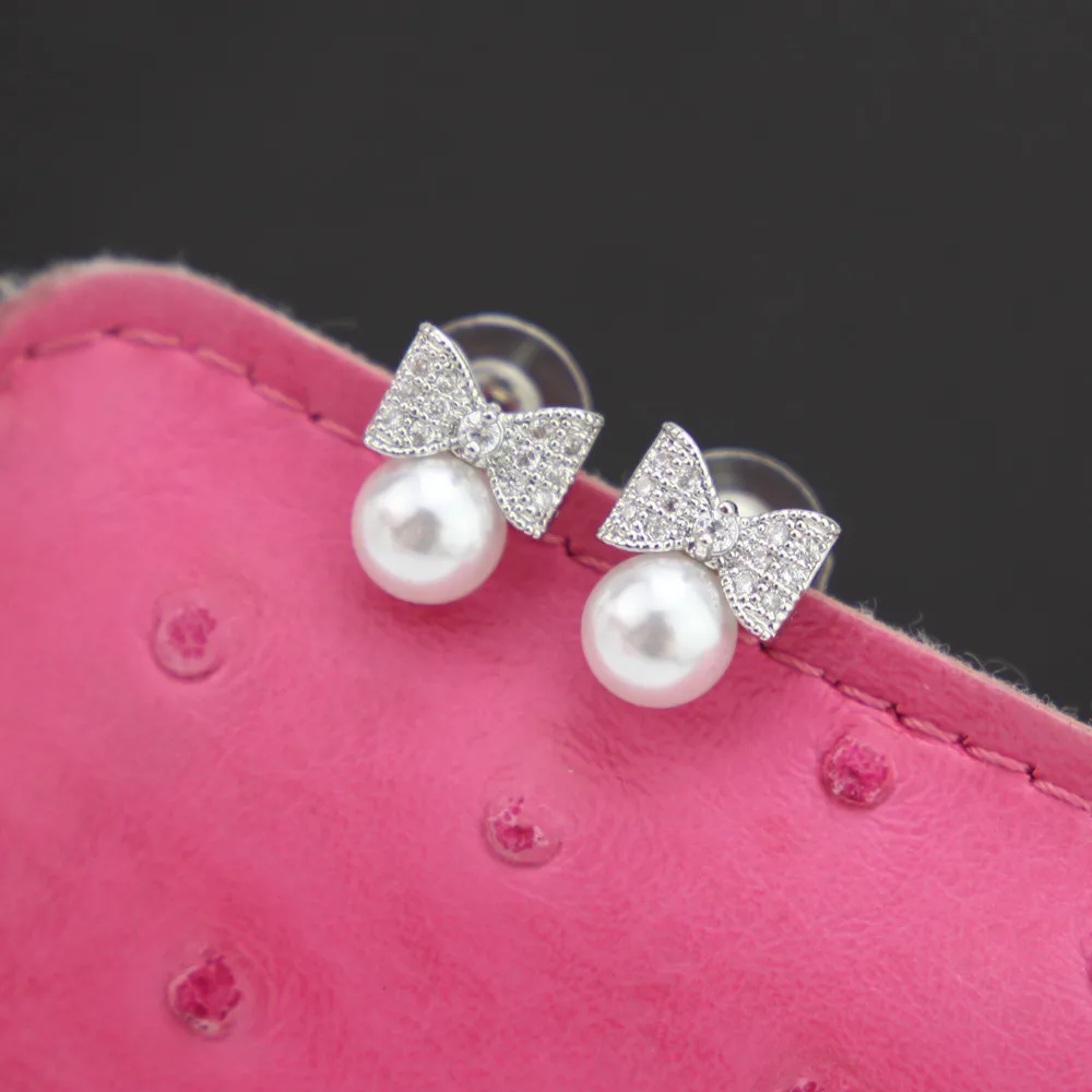 2018 Korean Sweet Zircon Crystal Bow Simulated Pearl S925 Sterling Silver Stud Earrings for Women Girls Wedding Party Jewelry
2018 Korean Sweet Zircon Crystal Bow Simulated Pearl S925 Sterling Silver Stud Earrings for Women Girls Wedding Party Jewelry