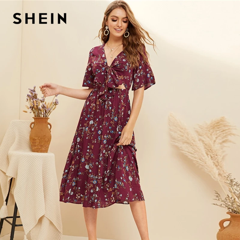 SHEIN Maroon Boho Ditsy Floral Print Knotted Front Peekaboo Dress Women V Neck Short Sleeve A Line High Waist Long Dress
SHEIN Maroon Boho Ditsy Floral Print Knotted Front Peekaboo Dress Women V Neck Short Sleeve A Line High Waist Long Dress