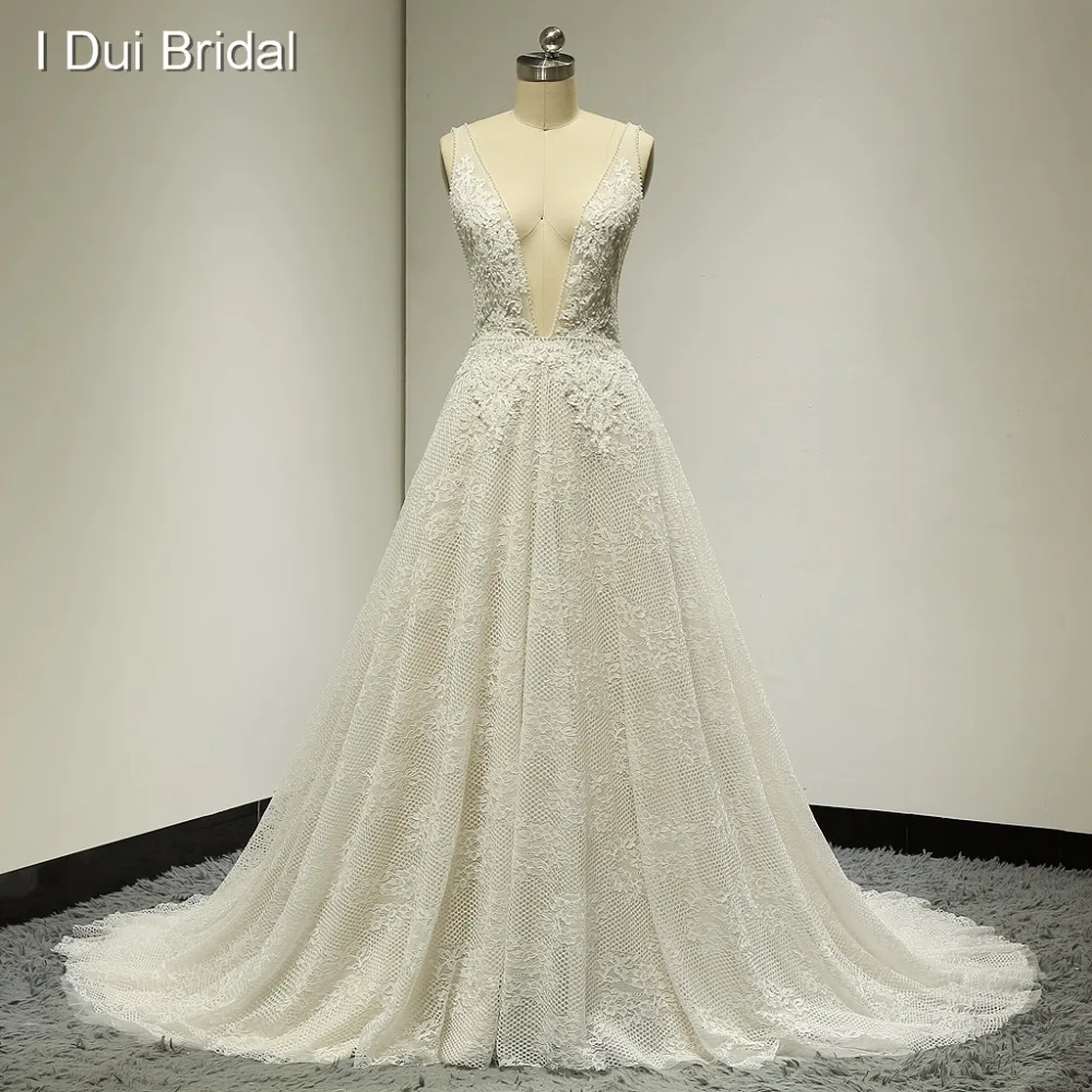 Sexy Boho Wedding Dresses Deep Neckline Low Back Pearl Crystal Beaded Lace Bridal Gown Factory Custom Made Real Photo
Sexy Boho Wedding Dresses Deep Neckline Low Back Pearl Crystal Beaded Lace Bridal Gown Factory Custom Made Real Photo