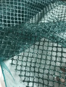 Fashion teal color embroidery tulle with glued glitter French net lace fabric Glitter mesh tulle fabric
Fashion teal color embroidery tulle with glued glitter French net lace fabric Glitter mesh tulle fabric