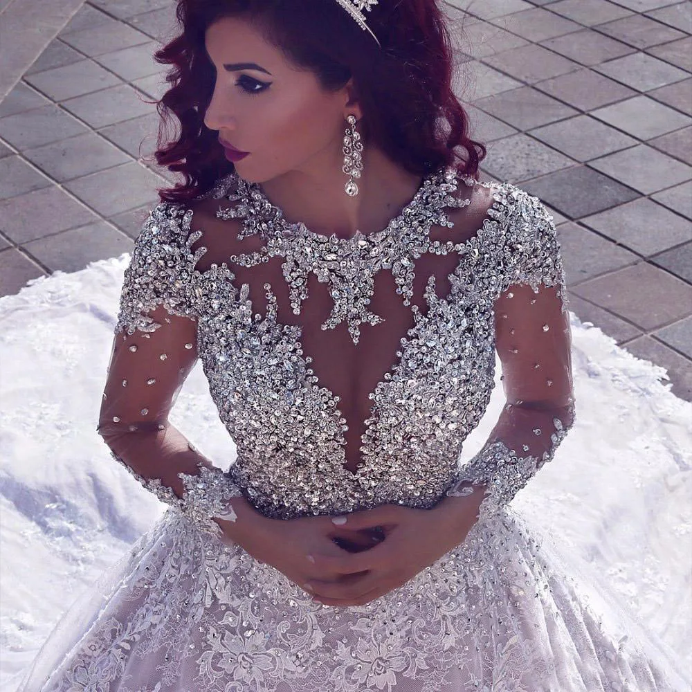 2019 Luxury Muslim Arabic Wedding Dress Ball Gown Long Sleeves Train Bling Beads Lace Wedding Dresses Backless Robe de mariage
2019 Luxury Muslim Arabic Wedding Dress Ball Gown Long Sleeves Train Bling Beads Lace Wedding Dresses Backless Robe de mariage
