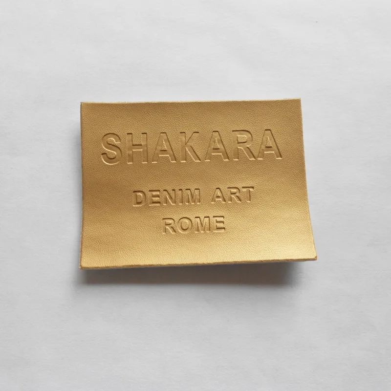 (1000pcs/lot) Customized metallic PU Leather labels/patches with brand LOGO for Jeans, golden Embossed shinning label
(1000pcs/lot) Customized metallic PU Leather labels/patches with brand LOGO for Jeans, golden Embossed shinning label