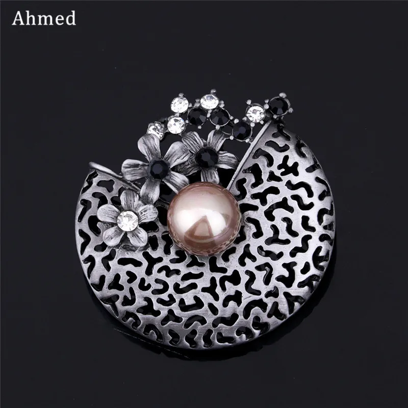 Ahmed Fashion Retro Rhinestone & Imitation Pearl Hollow flower Brooch For Women New Design Scarf Buckle Jewelry Corsage Ornament
Ahmed Fashion Retro Rhinestone & Imitation Pearl Hollow flower Brooch For Women New Design Scarf Buckle Jewelry Corsage Ornament