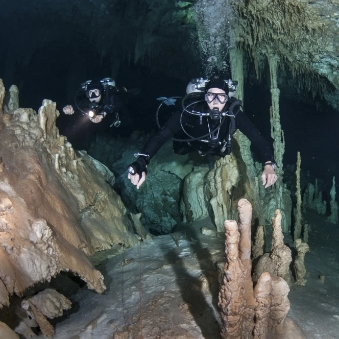 Technical divers in Dreamgate cave system in Mexico Poster Print (34 x 22)