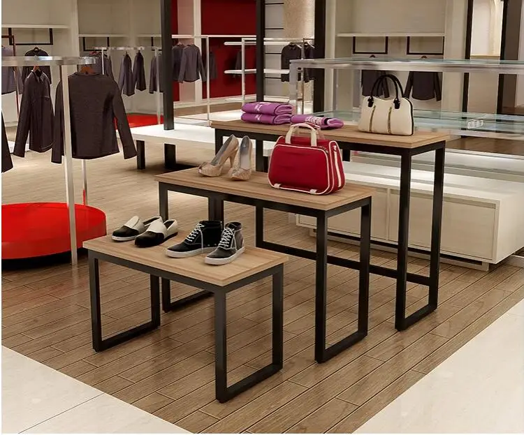 Clothing store high and low platform shopping mall display stand handbag and shoes rack running water table window nakashima .
Clothing store high and low platform shopping mall display stand handbag and shoes rack running water table window nakashima .