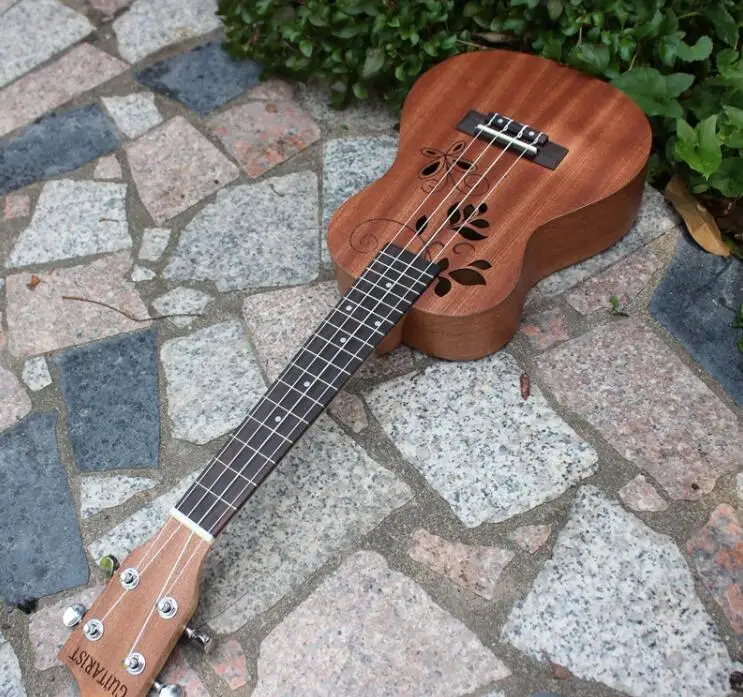 23 inch mahogany vine flower ukulele four-string small guitar uklele beginner musical instrument free shipping
23 inch mahogany vine flower ukulele four-string small guitar uklele beginner musical instrument free shipping