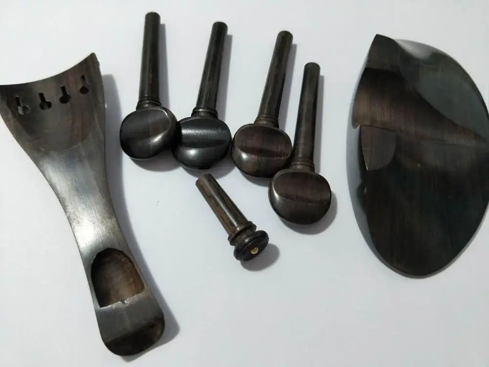 1 Set Violin Fitting ebony fiddle parts 4/4 including the tail piece chin rest pegs and end pin
1 Set Violin Fitting ebony fiddle parts 4/4 including the tail piece chin rest pegs and end pin