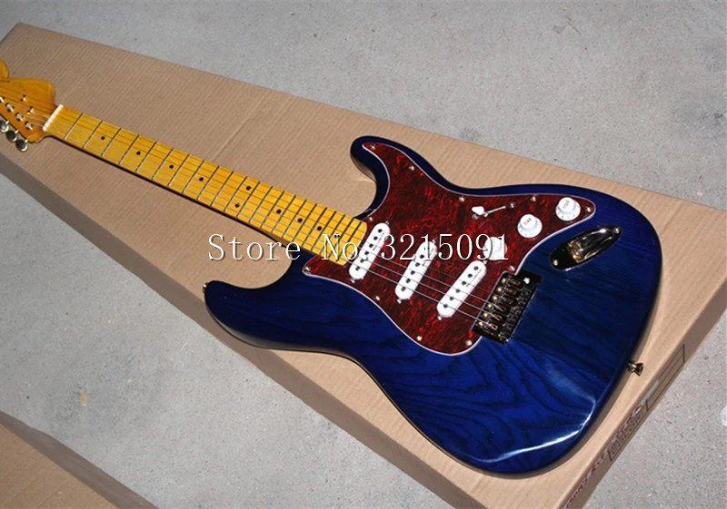 Transparent Blue ASH Body Electric Guitar with Retro color neck,Red Tortoise Shell Pickguard,3 Single Pickups,Offer Customized
Transparent Blue ASH Body Electric Guitar with Retro color neck,Red Tortoise Shell Pickguard,3 Single Pickups,Offer Customized