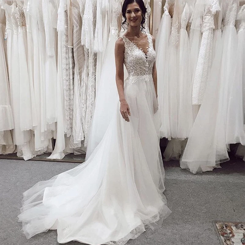 White Ivory Boho Wedding Dress V-neck Sleeveless A-line Bridal Gown Appliques Tulle Skirt Chapel Train Vestido De Novia Backless
White Ivory Boho Wedding Dress V-neck Sleeveless A-line Bridal Gown Appliques Tulle Skirt Chapel Train Vestido De Novia Backless