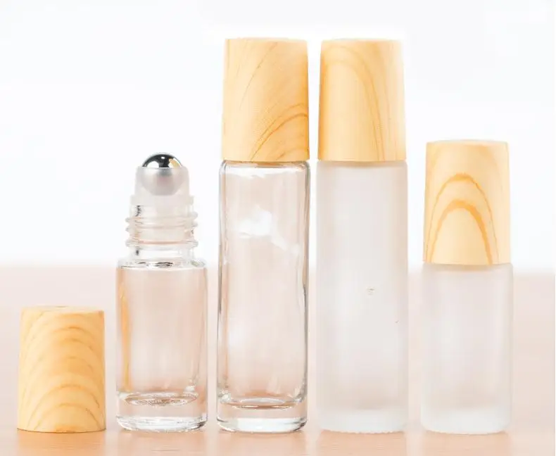 Frosted Clear Glass Roller Bottles Containers with Metal Roller Ball and Wood Grain Plastic Cap for Essential Oil Perfume SN1630
Frosted Clear Glass Roller Bottles Containers with Metal Roller Ball and Wood Grain Plastic Cap for Essential Oil Perfume SN1630