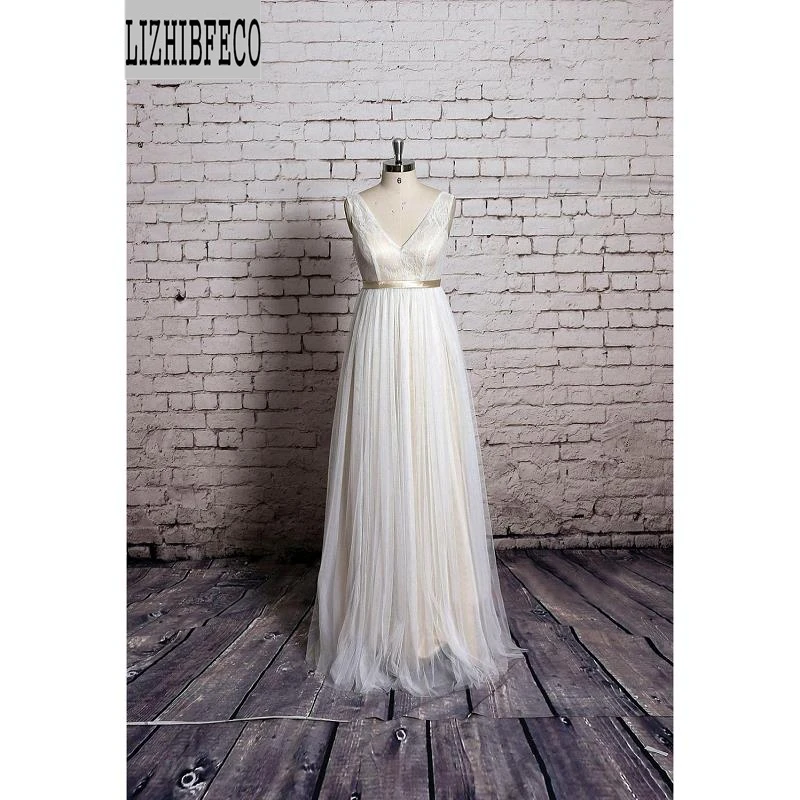 Ivory Tulle Lace Sleeveless Floor-Length V-Neck A-line Wedding dresses Belt Custom made
Ivory Tulle Lace Sleeveless Floor-Length V-Neck A-line Wedding dresses Belt Custom made