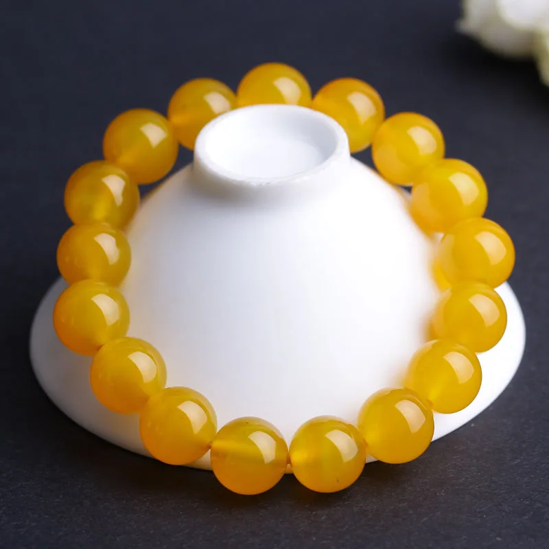 Желтые гладкие круглые браслеты из бусин натурального камня эластичные