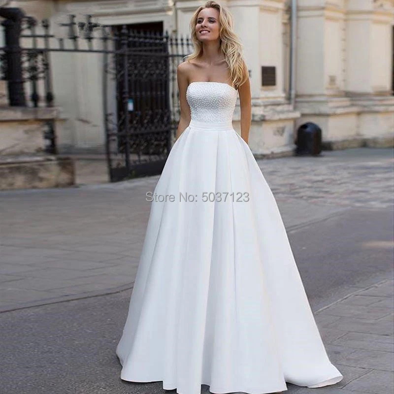 Satin A-Line Wedding Dresses 2019 Beading Backless Bridal Gowns Court Train Strapless Vestidos de Noivas White Custom Made
Satin A-Line Wedding Dresses 2019 Beading Backless Bridal Gowns Court Train Strapless Vestidos de Noivas White Custom Made