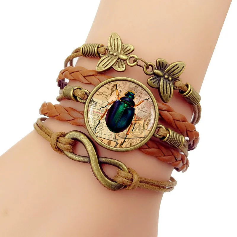 Multilayer Glass convex Egypt Scarab Vintage Butterfly Infinity bracelets Handmade Braided Knitted Leather bracelet for women
Multilayer Glass convex Egypt Scarab Vintage Butterfly Infinity bracelets Handmade Braided Knitted Leather bracelet for women