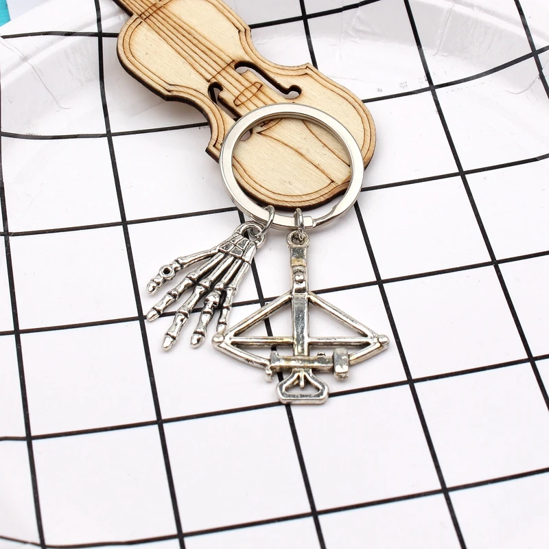 New Fashion Keychain The Walking Dead Pendants DIY Men Jewelry Car Key Chain Ring Holder Souvenir For Gift Bone Hand And Bow
New Fashion Keychain The Walking Dead Pendants DIY Men Jewelry Car Key Chain Ring Holder Souvenir For Gift Bone Hand And Bow