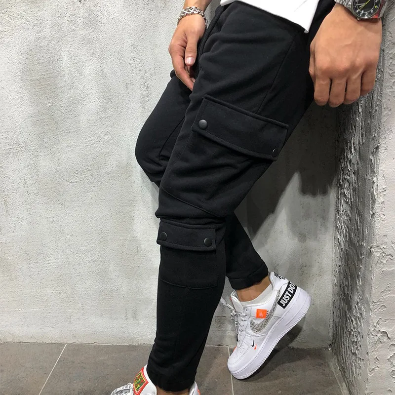 Brand Men Pants Fashion Mult-Pockets Decoration Splicing Harem Joggers Men Pants Male Casual Trousers GYMs Fitness Pencil Pants
Brand Men Pants Fashion Mult-Pockets Decoration Splicing Harem Joggers Men Pants Male Casual Trousers GYMs Fitness Pencil Pants