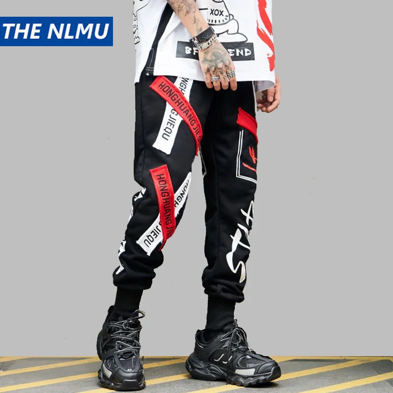 Hip Hip Streetwear Men's Sweatpants Patch Design Joggers Pants Men 2019 Spring Casual Letter Printed Harem Pants Trousers WJ224
Hip Hip Streetwear Men's Sweatpants Patch Design Joggers Pants Men 2019 Spring Casual Letter Printed Harem Pants Trousers WJ224