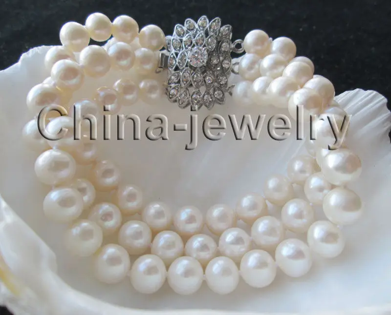 Free Shipping >>>>> Beautiful 8" 3row 9mm white round freshwater pearl bracelet - GP clasp
Free Shipping >>>>> Beautiful 8" 3row 9mm white round freshwater pearl bracelet - GP clasp