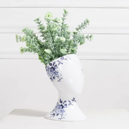 Abstract artwork head blue and white porcelain vase ornaments ceramic dried flower pots
Abstract artwork head blue and white porcelain vase ornaments ceramic dried flower pots