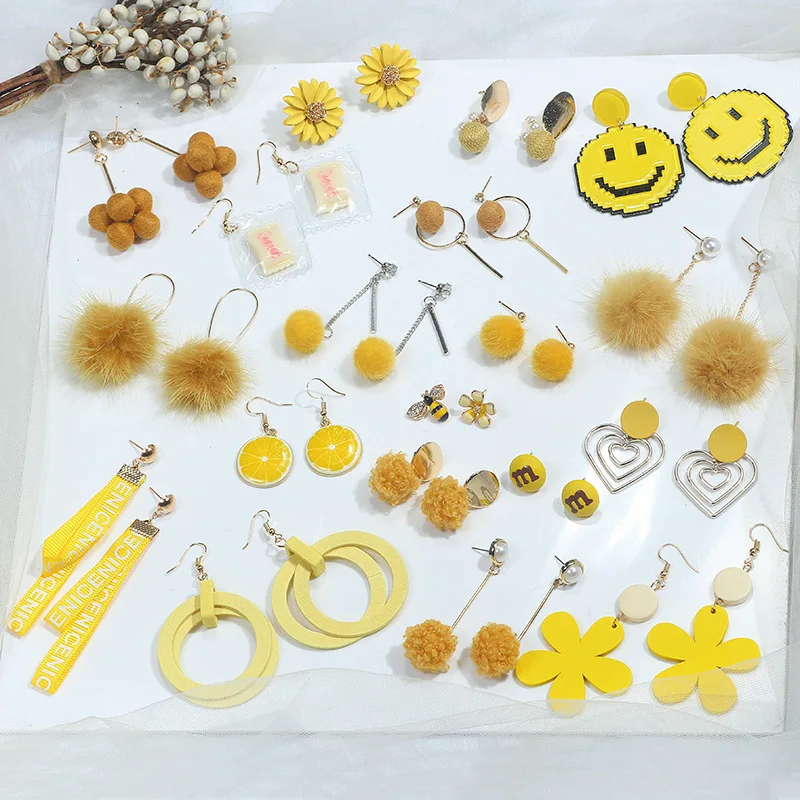 Yellow Korean version of the trend of bright yellow earrings fashion flowers wild hair ball fabric long earrings
Yellow Korean version of the trend of bright yellow earrings fashion flowers wild hair ball fabric long earrings
