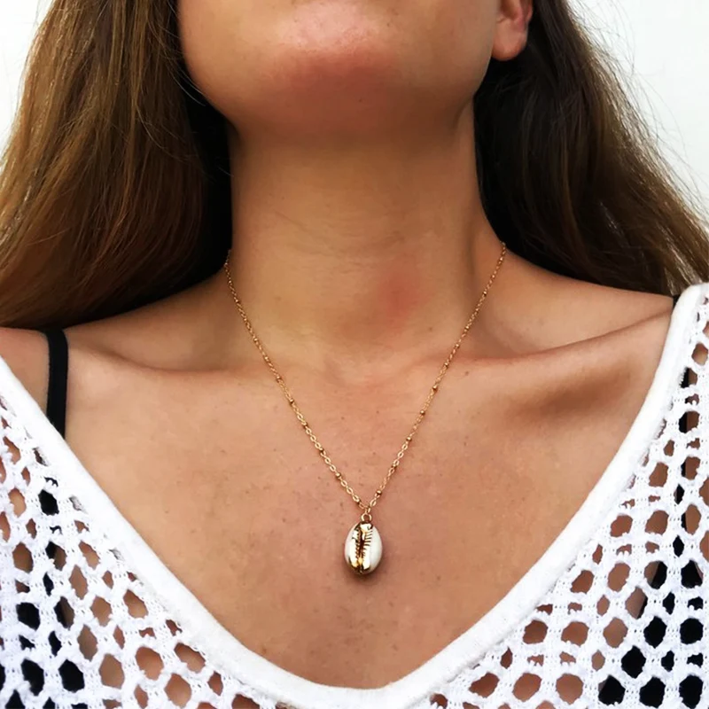 Fashion Natural Shell-Wrapped Gold Necklace for Women Natural Cowrie Shell Pendant With Double Bails Gold Trim Chain Necklace
Fashion Natural Shell-Wrapped Gold Necklace for Women Natural Cowrie Shell Pendant With Double Bails Gold Trim Chain Necklace
