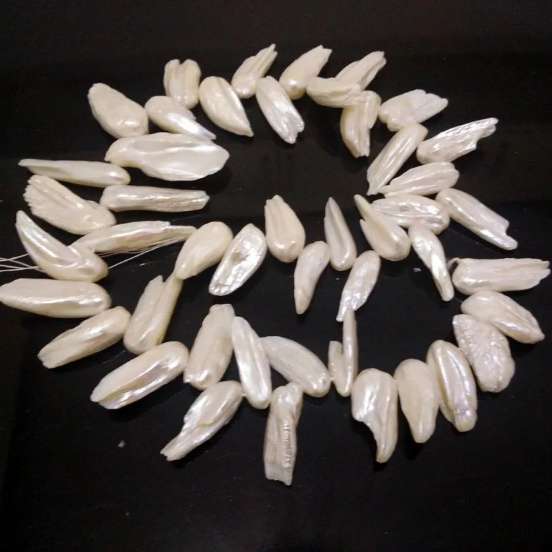 16 inches 20-35mm White Side Drilled Leaf Shaped Biwa Blister Pearl Loose Strand
16 inches 20-35mm White Side Drilled Leaf Shaped Biwa Blister Pearl Loose Strand