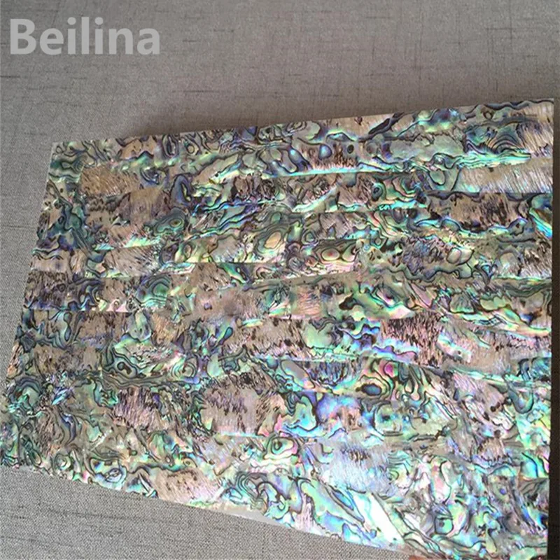 New Zealand panua abalone shell laminate sheet for carved material and wood inlay home crafts decoration green color 0.25mm
New Zealand panua abalone shell laminate sheet for carved material and wood inlay home crafts decoration green color 0.25mm