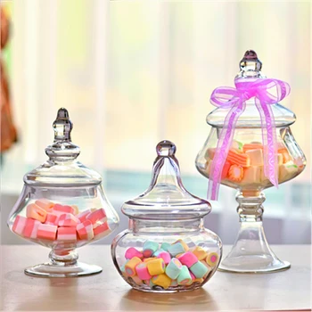 Creative transparent Glass candy jar bottles dust-proof with lid Decor Crafts dessert stand storage tank vase wedding supplies
Creative transparent Glass candy jar bottles dust-proof with lid Decor Crafts dessert stand storage tank vase wedding supplies