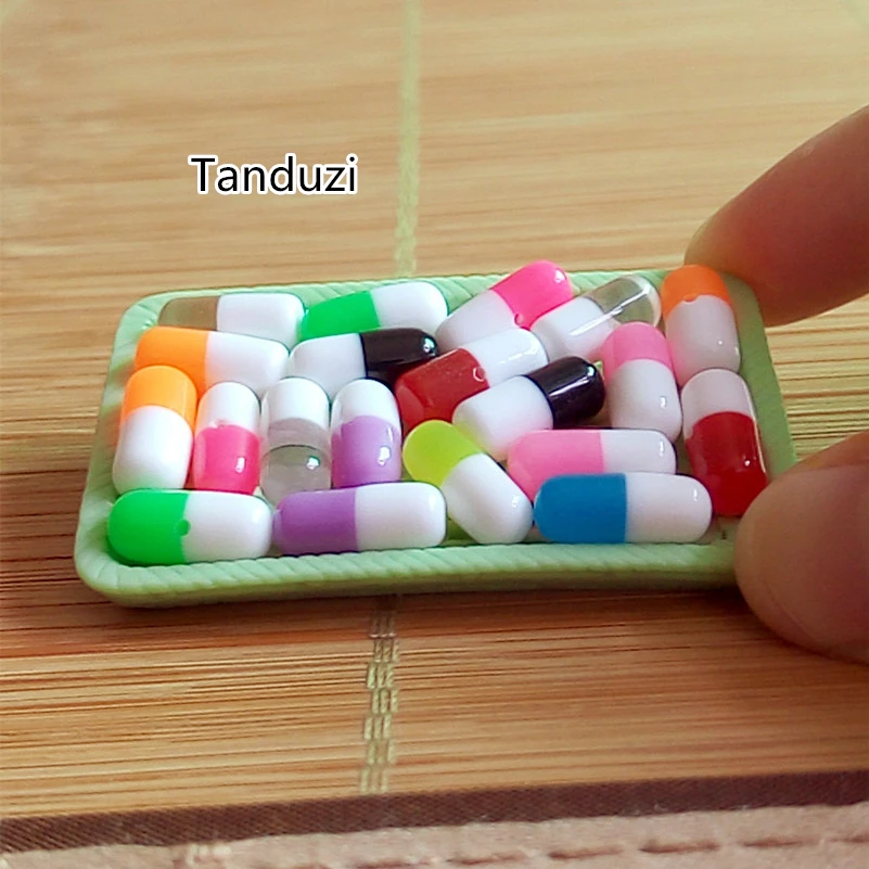 Tanduzi Wholesale 100PCS Mix Color Mini Resin Capsule Pill Dollhouse Miniature Doctor Pills Earring DIY Accessory
Tanduzi Wholesale 100PCS Mix Color Mini Resin Capsule Pill Dollhouse Miniature Doctor Pills Earring DIY Accessory