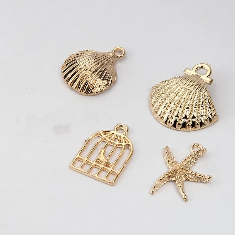 100pcs/lot Gold Tone Shell/Starfish/Bird in cage Charms for handmade diy jewelry accessories bracelet necklace findings making
100pcs/lot Gold Tone Shell/Starfish/Bird in cage Charms for handmade diy jewelry accessories bracelet necklace findings making