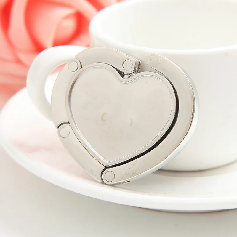 Brand New Heart Shape Foldable Purse Handbag Hanger Hook Holder Folding Bag Handbag Table Hook Home Decor Gift
Brand New Heart Shape Foldable Purse Handbag Hanger Hook Holder Folding Bag Handbag Table Hook Home Decor Gift