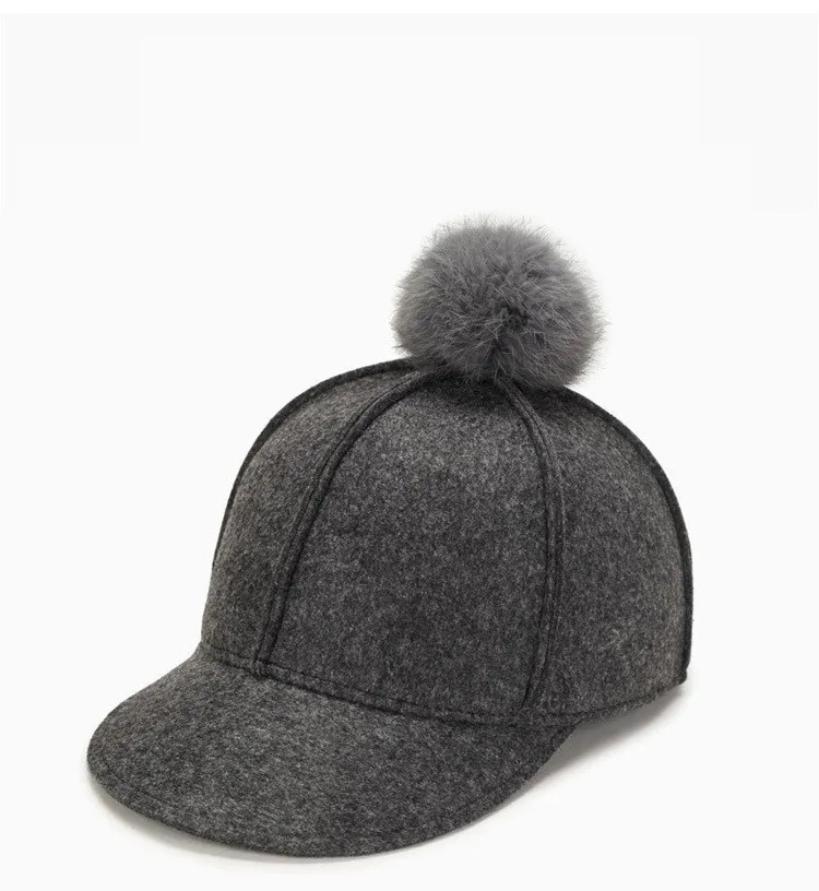 fitted hat with fur ball