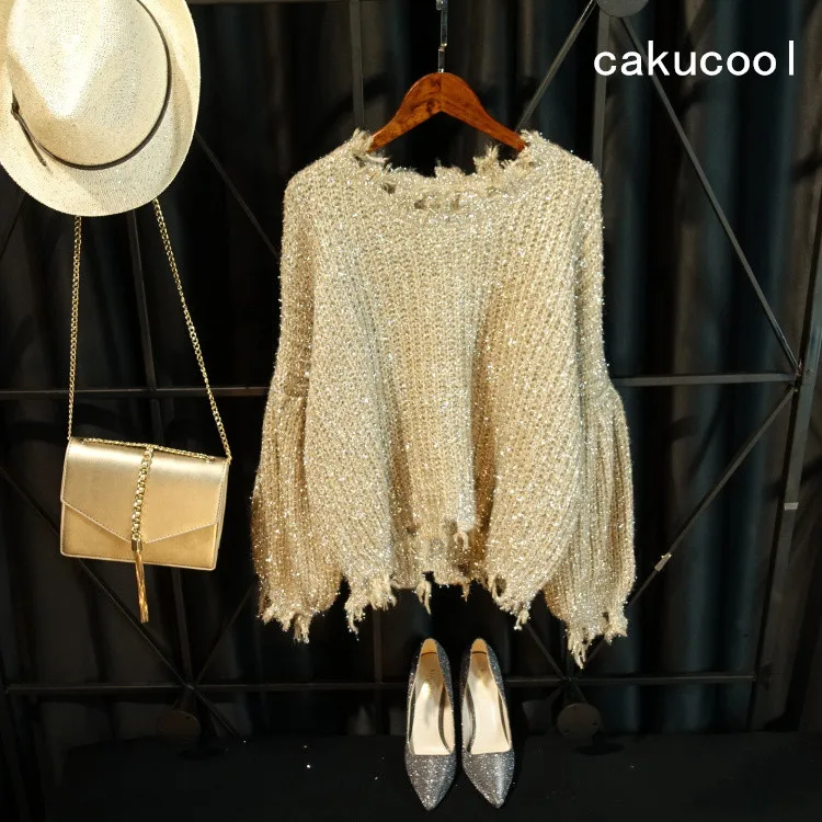 Cakucool Hot gold lurex Knit Top Women Long Lantern Sleeve Big O-neck Holes Ripped Loose Embellish Sweater Jumper Knit Pull Girl
Cakucool Hot gold lurex Knit Top Women Long Lantern Sleeve Big O-neck Holes Ripped Loose Embellish Sweater Jumper Knit Pull Girl