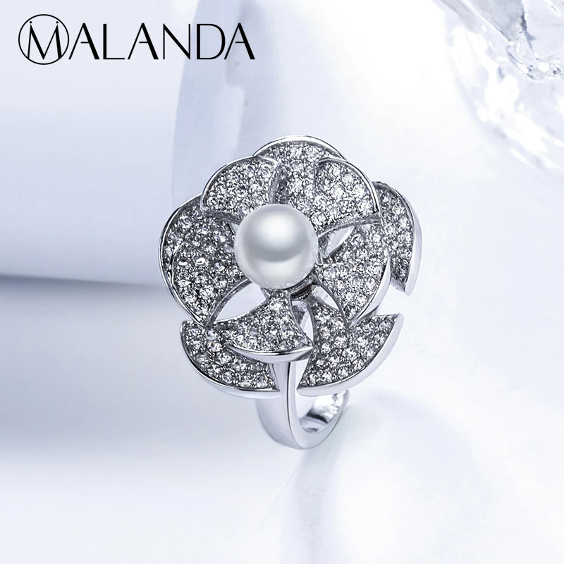 

MALANDA Rotate Sunflower Rings For Women Fashion AAAA Zircon Pearl Rings Exaggerate Female Wedding Party Rings Jewelry Gift 2018
