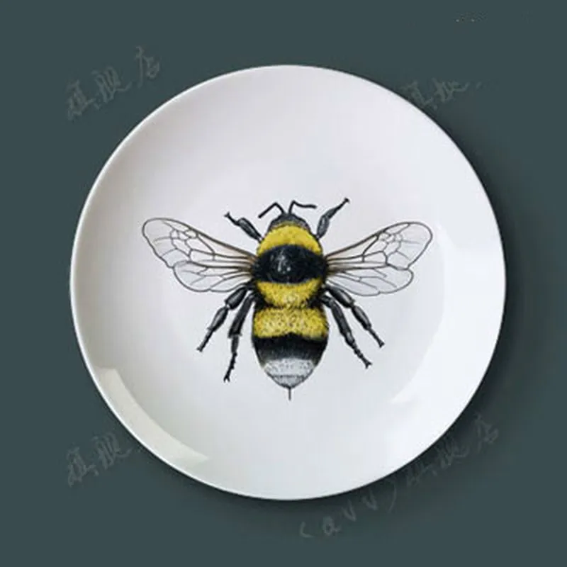Porcelain Decorative Plate Wall Hanging Plate Insect Sitting Disc Plate Ceramic Disc Home Furnishing Art Creative Gifts
Porcelain Decorative Plate Wall Hanging Plate Insect Sitting Disc Plate Ceramic Disc Home Furnishing Art Creative Gifts