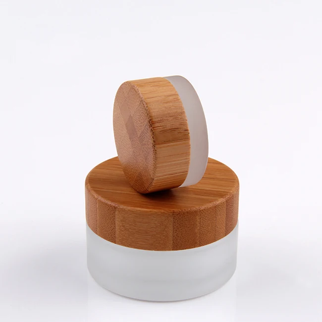105pcs*30g cosmetic cream container clear frosted glass jar with bamboo wood cap 1 oz clear cosmetics face cream jar
105pcs*30g cosmetic cream container clear frosted glass jar with bamboo wood cap 1 oz clear cosmetics face cream jar