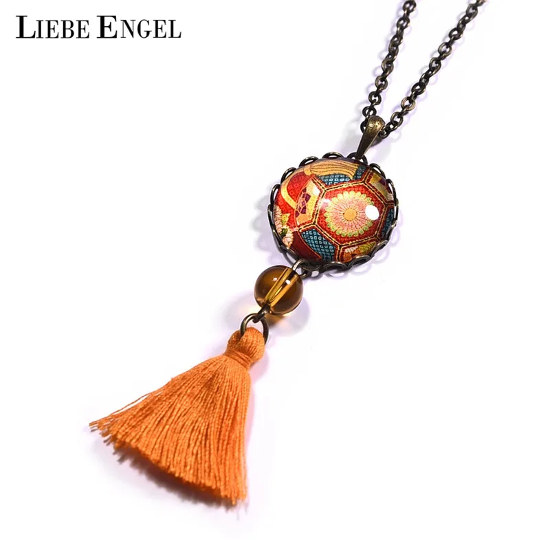 LIEBE ENGEL Bohemian Vintage Tassel Pendant Orange Color Glass Cabochon necklace Creative Print Dangle necklace Women Jewelry
LIEBE ENGEL Bohemian Vintage Tassel Pendant Orange Color Glass Cabochon necklace Creative Print Dangle necklace Women Jewelry