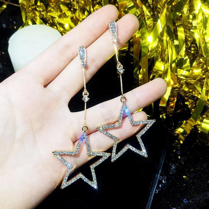SUKI 2019 crystal five-pointed star pendant earrings Brincos ladies fashion long stars earrings pendant manufacturers
SUKI 2019 crystal five-pointed star pendant earrings Brincos ladies fashion long stars earrings pendant manufacturers