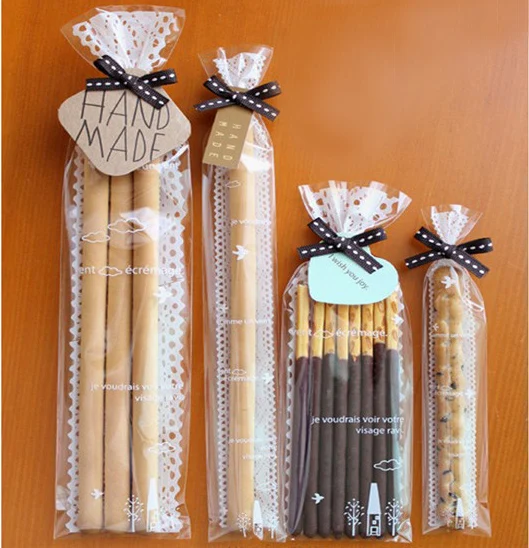 500pcs Transparent lace pattern cookie bag, gift wrapping paper plastic bags , chocolate bars packing bag 
500pcs Transparent lace pattern cookie bag, gift wrapping paper plastic bags , chocolate bars packing bag