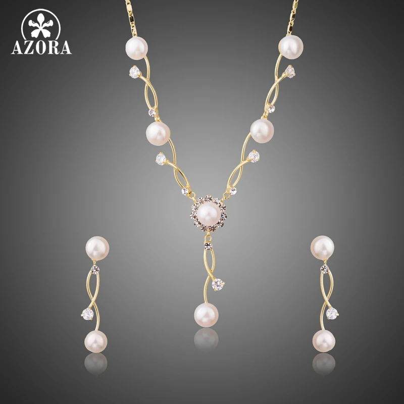 AZORA Gold Color Simulated Pearl Vines Set with Austrian Cryatal Vintage Engagement Earrings and Necklace Jewelry Sets TG0220
AZORA Gold Color Simulated Pearl Vines Set with Austrian Cryatal Vintage Engagement Earrings and Necklace Jewelry Sets TG0220