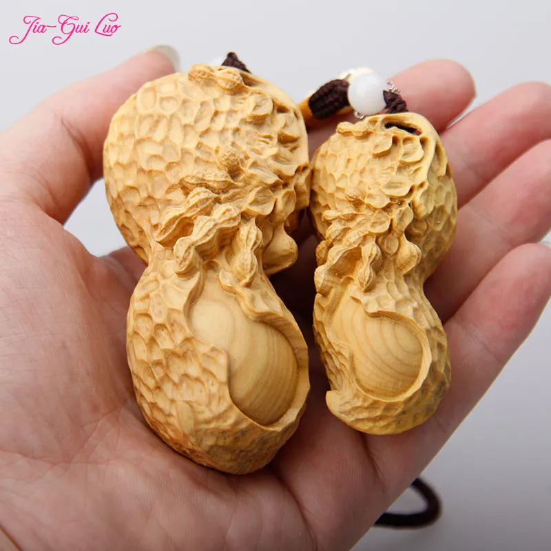 JIA-GUI LUO Peanut boxwood carved car pendant decoration wooden crafts home decoration pendant Valentine 's Day gift A008
JIA-GUI LUO Peanut boxwood carved car pendant decoration wooden crafts home decoration pendant Valentine 's Day gift A008