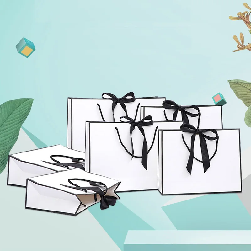 100pcs/lot Creative design Black border White kraft paper bag with handle Wedding Party Favor bowknot Paper Gift Bag Custom logo
100pcs/lot Creative design Black border White kraft paper bag with handle Wedding Party Favor bowknot Paper Gift Bag Custom logo